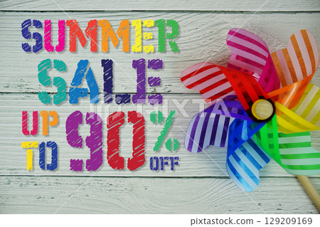 Summer Sale 90% off text with Colorful Windmill on wooden background 129209169
