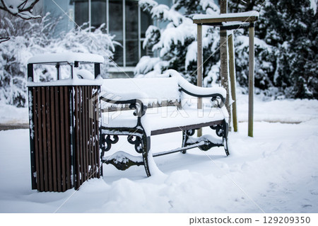 Snow Covered Bench and Trash Can in Winter Park Snow Covered Bench and Trash Can in Winter Park 129209350
