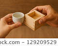 Toasting with sake cups and masu cups 129209529