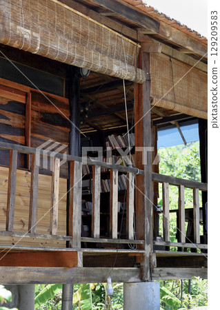 Fragment of the wooden house in Buddhist Hua Da Bao Monastery in Nha Trang, Vietnam Fragment of the wooden house in Buddhist Hua Da Bao Monastery in Nha Trang, Vietnam 129209583