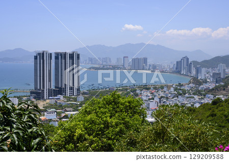 View from the mountain to the city with skyscrapers on the shore of the Gulf of the South China Sea 129209588