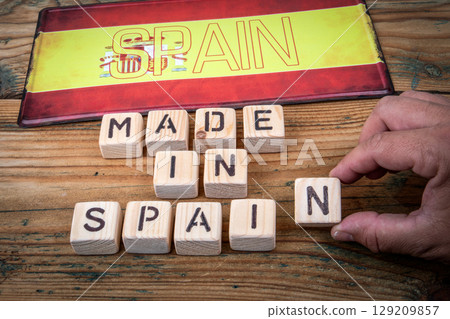 Made in Spain Concept with Wooden Blocks and Spanish Flag Made in Spain Concept with Wooden Blocks and Spanish Flag 129209857