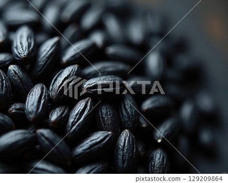 Macro of Raw Black Rice Grains with Intricate Matte Texture and Soft Top Lighting 129209864