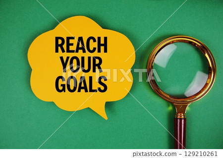 Reach Your Goals text with speech bubble and magnifying glass on green background Reach Your Goals text with speech bubble and magnifying glass on green background 129210261
