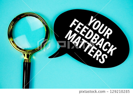 Your Feedback Matters text with speech bubble and magnifying glass on blue background Your Feedback Matters text with speech bubble and magnifying glass on blue background 129210285