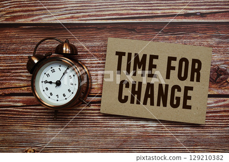Time For Change text with alarm clock on wooden background 129210382