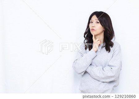 A woman who is seriously worried A woman who is seriously worried 129210860