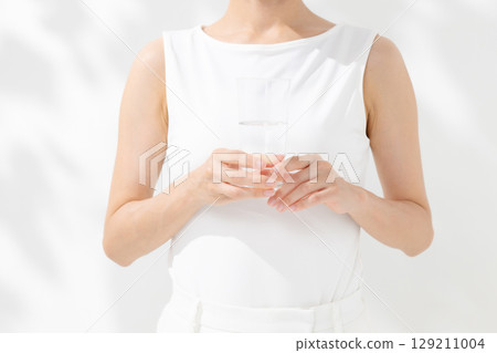 Women drinking water hand Women drinking water hand 129211004