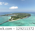 Aerial shot of the long Ikema Bridge connecting Miyako Island and Ikema Island in Okinawa Prefecture, where the beautiful sea stretches out, taken using a drone 129211372