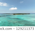 Aerial shot of the long Ikema Bridge connecting Miyako Island and Ikema Island in Okinawa Prefecture, where the beautiful sea stretches out, taken using a drone 129211373