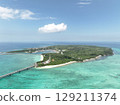 Aerial shot of the long Ikema Bridge connecting Miyako Island and Ikema Island in Okinawa Prefecture, where the beautiful sea stretches out, taken using a drone 129211374