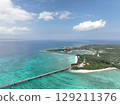 Aerial shot of the long Ikema Bridge connecting Miyako Island and Ikema Island in Okinawa Prefecture, where the beautiful sea stretches out, taken using a drone 129211376