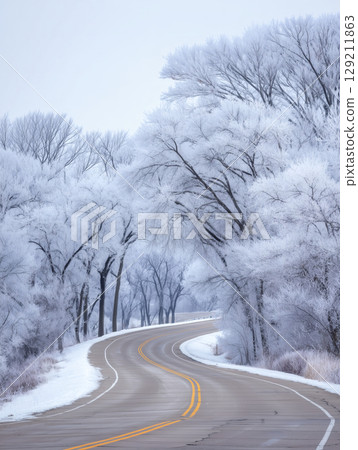 Winding road in the snow 129211863