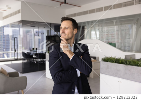 Pensive middle-aged Hispanic businessman ponder on solution or idea Pensive middle-aged Hispanic businessman ponder on solution or idea 129212322