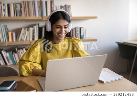 Woman participate in videocall by business or study using laptop 129212486