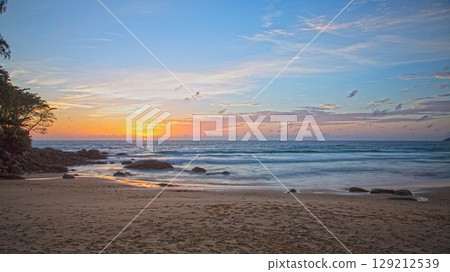 Sunset over Kata Beach with rocky shore Phuket 129212539