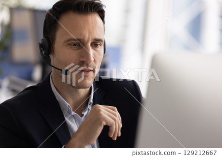 Call center worker assisting customer remotely, closeup 129212667