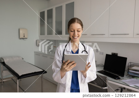 Cheerful young physician woman chatting with patients on telehealth service Cheerful young physician woman chatting with patients on telehealth service 129212864