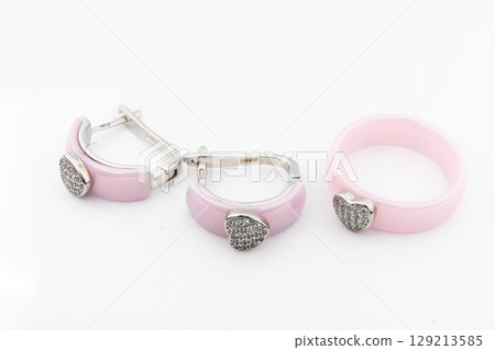 Silver jewelry set of ring and silver earrings with stones on white background. Silver jewelry set collection Silver jewelry set of ring and silver earrings with stones on white background. Silver jewelry set collection 129213585