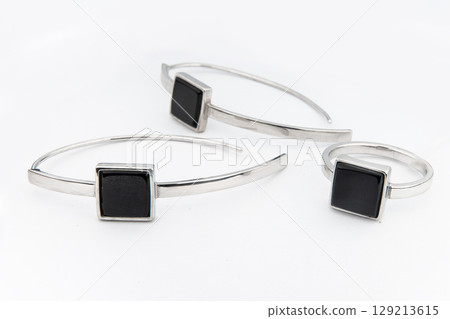 Silver jewels collection with crystals in minimalism style. Silver set of earrings and silver necklace Silver jewels collection with crystals in minimalism style. Silver set of earrings and silver necklace 129213615