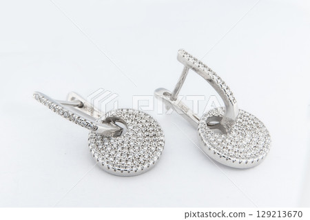 Luxury silver round earrings big jewelry for women isolated on white background, clipping path included 129213670