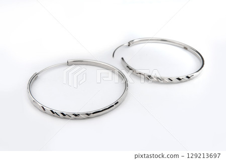Luxury silver round earrings big jewelry for women isolated on white background, clipping path included 129213697