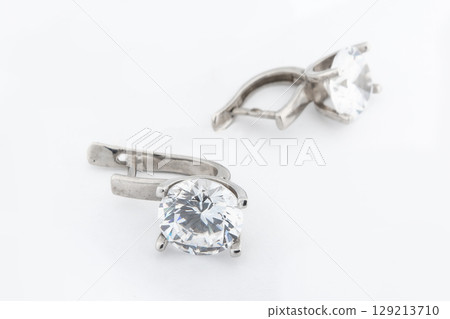 Luxury silver round earrings big jewelry for women isolated on white background, clipping path included Luxury silver round earrings big jewelry for women isolated on white background, clipping path included 129213710