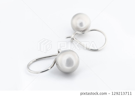 Luxury silver round earrings big jewelry for women isolated on white background, clipping path included Luxury silver round earrings big jewelry for women isolated on white background, clipping path included 129213711