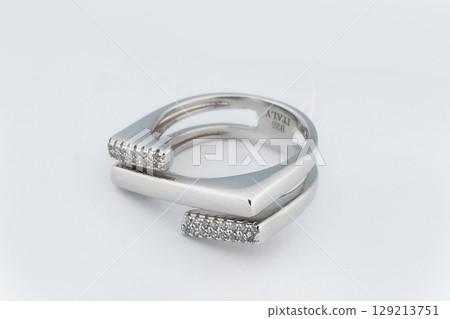 Silver minimalism diamond ring isolated on white background Silver minimalism diamond ring isolated on white background 129213751