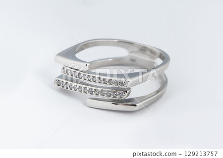 Silver minimalism diamond ring isolated on white background Silver minimalism diamond ring isolated on white background 129213757