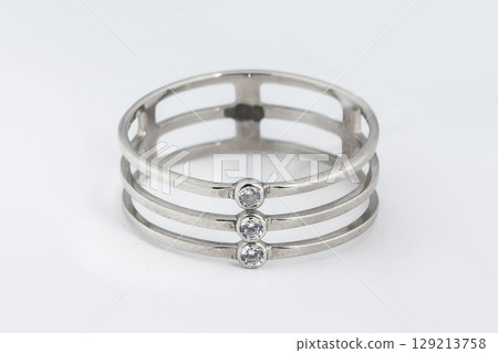 Silver minimalism diamond ring isolated on white background Silver minimalism diamond ring isolated on white background 129213758