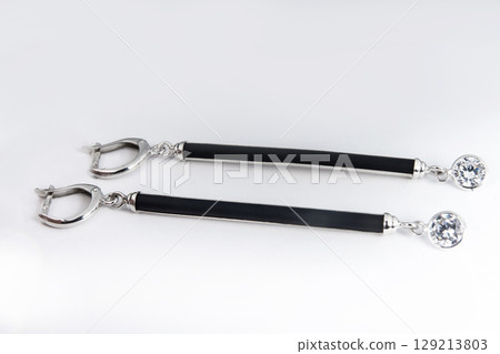 Luxury silver round earrings big jewelry for women isolated on white background, clipping path included Luxury silver round earrings big jewelry for women isolated on white background, clipping path included 129213803