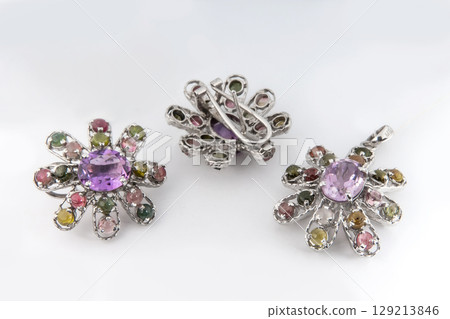 Elegant jewelry set of white gold ring, necklace and earrings with diamonds. Silver jewellery set with gemstones. Product still life concept 129213846