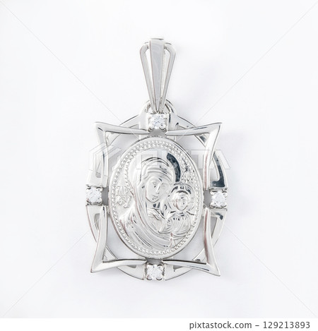 Gold pendant with the Virgin Mary christian symbol isolated on white 129213893