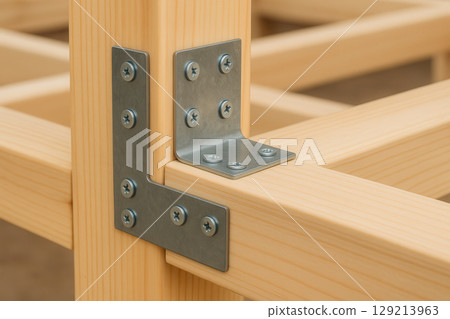 Close up of metal corner bracket joining pine wooden beams in a sturdy frame construction for carpentry and woodworking projects, AI Generative 129213963