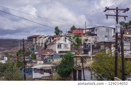 Gritty panorama of Colonia Libertad neighborhood, Tijuana, with weathered homes, reflecting social and economic struggles amid crime and poverty.  129214032