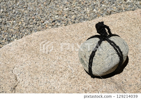 A sword stone in a Japanese garden that indicates no entry 129214039