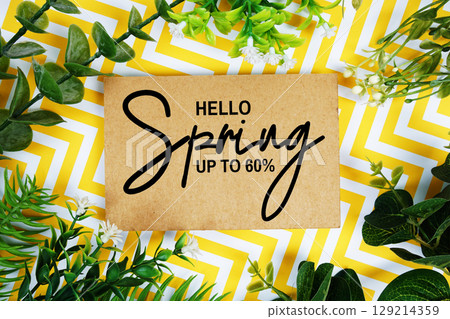 Hello Spring Sale 80% off with artificial leaf decoration on yellow chevron background Hello Spring Sale 80% off with artificial leaf decoration on yellow chevron background 129214359