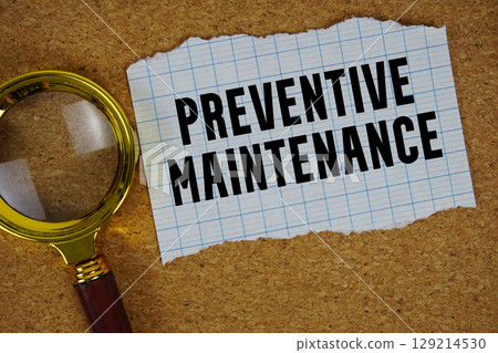 Preventive Maintenance text written on paper with magnifying glass 129214530