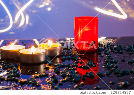 In the candlelight, the golden ring appears especially festive and precious 129214597