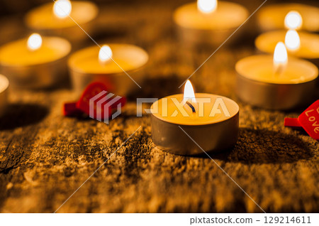 The burning candles fill the space with soft light 129214611