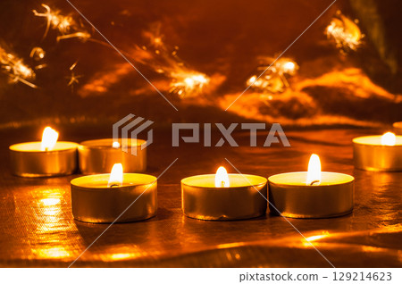 Candles New Year sparkle in the dark, bringing hope 129214623