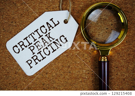 Critical Peak Pricing text on price tag with magnifying glass on cork board background Critical Peak Pricing text on price tag with magnifying glass on cork board background 129215408