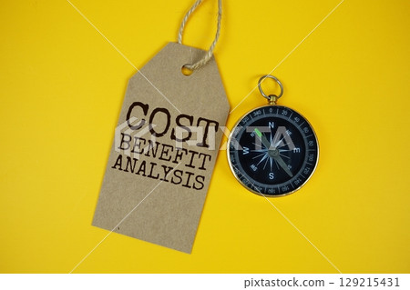 Cost Benefit Analysis text on price tag with compass on cork board background 129215431
