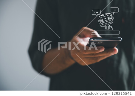 AI chatbot assistant on a phone, a digital service providing conversation with an internet bot application, customer service replies are automatic via AI using smart phone messaging AI chatbot assistant on a phone, a digital service providing conversation with an internet bot application, customer service replies are automatic via AI using smart phone messaging 129215841