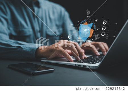 AI helps generate business with intelligent automation and a BPA system while a businessman at his desk uses a laptop to give instructions to the AI, driving process automation efficiently AI helps generate business with intelligent automation and a BPA system while a businessman at his desk uses a laptop to give instructions to the AI, driving process automation efficiently 129215842