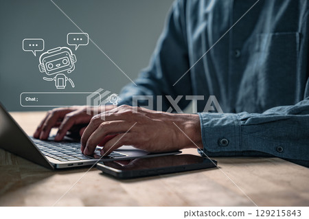 AI helps generate content using a prompt chatbot, shown as a virtual assistant on a computer, with a man working in digital creative fields using the AI app for data search AI helps generate content using a prompt chatbot, shown as a virtual assistant on a computer, with a man working in digital creative fields using the AI app for data search 129215843