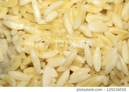 Close up of orzo pasta rice shaped carbs tasty cooked 129216038