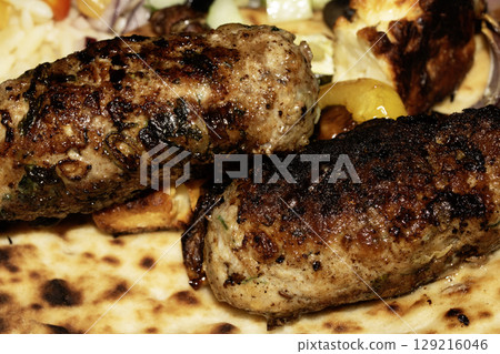Close up of juicy lamb kofta kebab on a flatbread 129216046