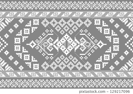 Intricate ethnic pixel art tapestry pattern in a serene grey monochrome palette. Ideal for textiles, digital wallpapers, and traditional or modern art projects. 129217096